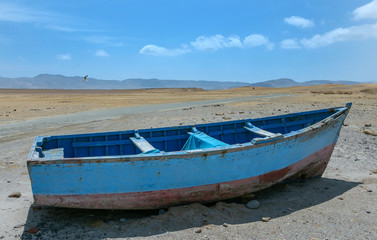 Fototapeta na wymiar Paracas. Peru. Boat in the desert.