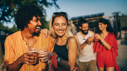 Group of friends having fun time at music festival