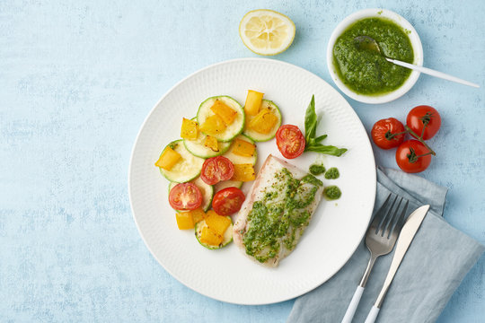 Keto Dinner With White Fish. Oven Baked Fillet Of Cod, Pike Perch With Vegetables And Pesto Sauce