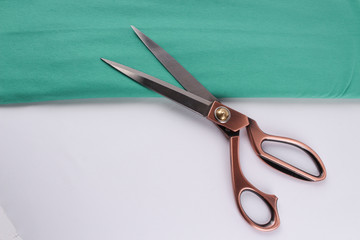 scissors and canvas fabric on a white background