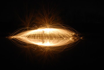 Burning Circle with water reflection in a pond