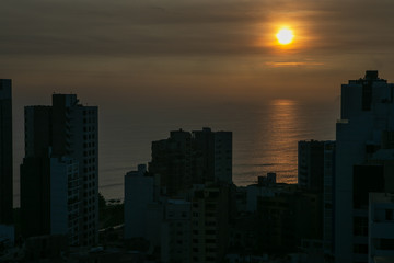 Fototapeta na wymiar Sunset Miraflores Peru. Coast. Buildings. Apartments