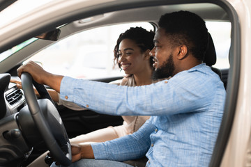 Afro Spouses Sitting In Car Choosing Family Auto In Dealership
