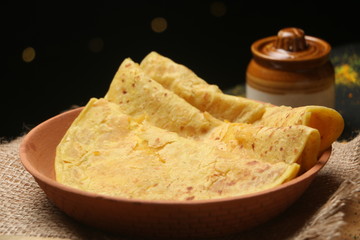 PopuIndian sweet bread known as Puran poli (Gram floor and jaggery stuffed bread), Dahi vada, thandai are well known indian Holi snack. (Holi Concept)