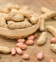 A pile of peanuts in a bamboo basket