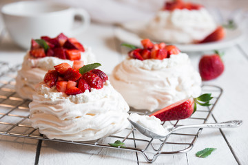 Delicious Pavlova cake with meringue and fresh strawberries - obrazy, fototapety, plakaty