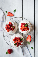 Obraz na płótnie Canvas Delicious Pavlova cake with meringue and fresh strawberries
