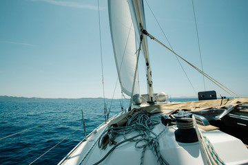 Naklejka premium Ship deck on a yacht on the sea with blue sky. Sailing and yachting concept.