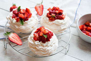 Delicious Pavlova cake with meringue and fresh strawberries