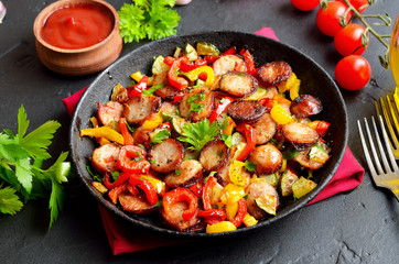 Grilled vegetables with sausages and herbs
