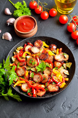 Grilled vegetables with sausages and herbs