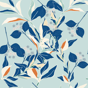 Floral ornament of white and blue leaves on a blue background. Seamless pattern with floral motifs. Vector illustration. © Galina Trenina
