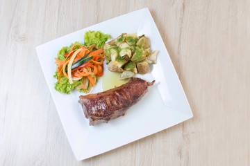 Premium Meat Cut   Beef Cuts - Sterling Silver, accompanied by vegetables and potatoes