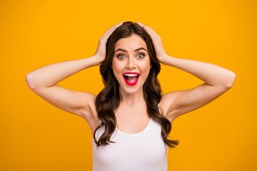 Closeup photo of beautiful pretty lady open mouth arms on head listen positive good mood surprised funky wear white tank-top isolated bright yellow color background