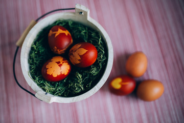 Traditionally dyed Easter eggs dyed with onion peels with a pattern of plants.