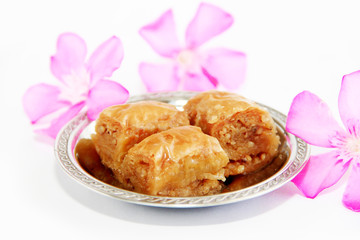 traditional oriental sweet baklava on a decorative plate