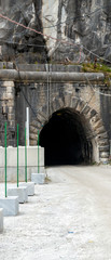 detail of a tunnel that permit to go inside a marble quarry in carrara , italy