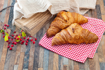 Delicious fresh croissant on table