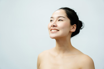 Portrait nude young Asian woman Close up of beautiful faces Feel Happy. Smile with a healthy white...