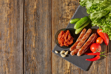 Grilled meat sausages with vegetables