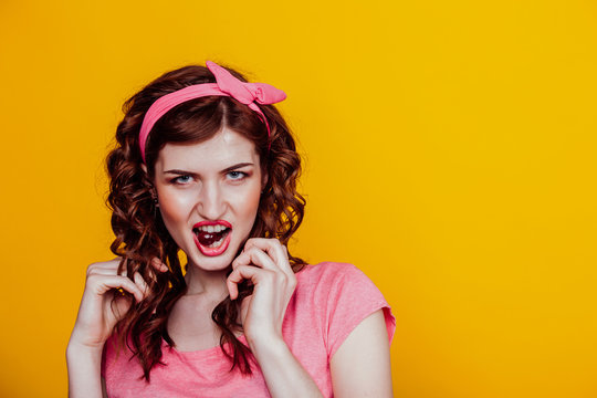 Portrait of a beautiful fashionable woman in pink pinap clothes