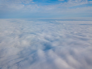 Fototapeta na wymiar Drone flying above the clouds