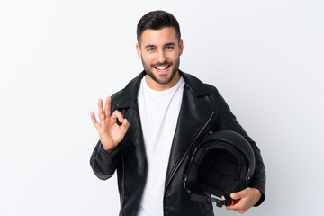 Fototapeta premium Man with a motorcycle helmet showing an ok sign with fingers