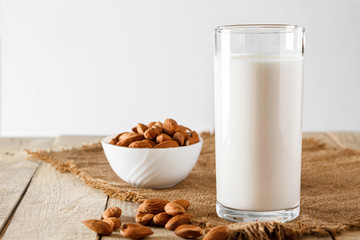 Super Food - A glass of almond milk for a healthy diet. Trending food, vertical photo. Place for your text.
