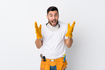 Craftsmen or electrician man over isolated white background with surprise facial expression