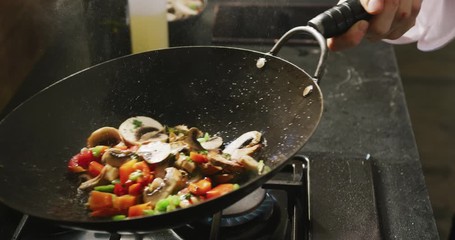 Chef cooking vegetables - Powered by Adobe