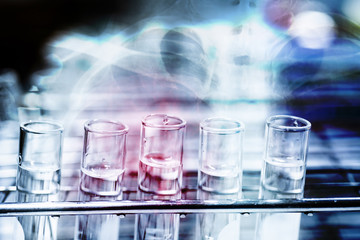 Double exposure test-tube coronavirus analysis concept in laboratory.
