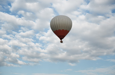 One hot air balloon flying in the sky