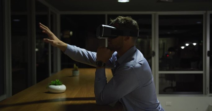 Businessman using VR helmet in a modern office