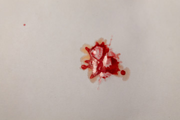red paint spot on white background paper