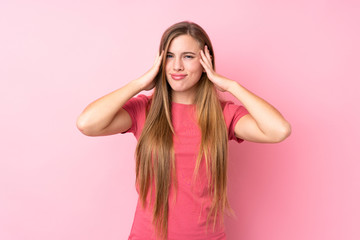 Teenager blonde girl over isolated pink background unhappy and frustrated with something. Negative facial expression