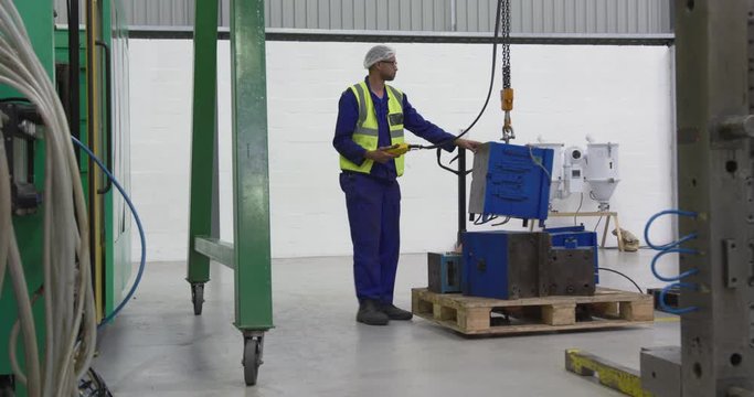Warehouse worker pulling a warehouse aisle