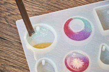 Pouring and mixing glitter clear resin  resin mold , process of prepare for make an accessories