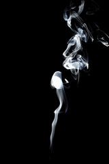 Fototapeta na wymiar White smoke on black background