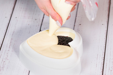 Step by step process of making mousse cake with mirror glaze. Cooking french dessert. Frozen mirror icing on the cake.