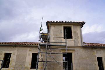 Fototapeta na wymiar Reconstruction building ancient scaffolding restoration in construction site