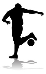 Fototapeta na wymiar A soccer or football player in silhouette