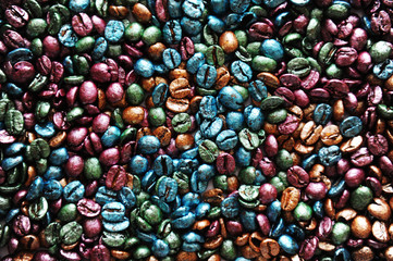 Multi-colored painted pearl coffee beans texture background.