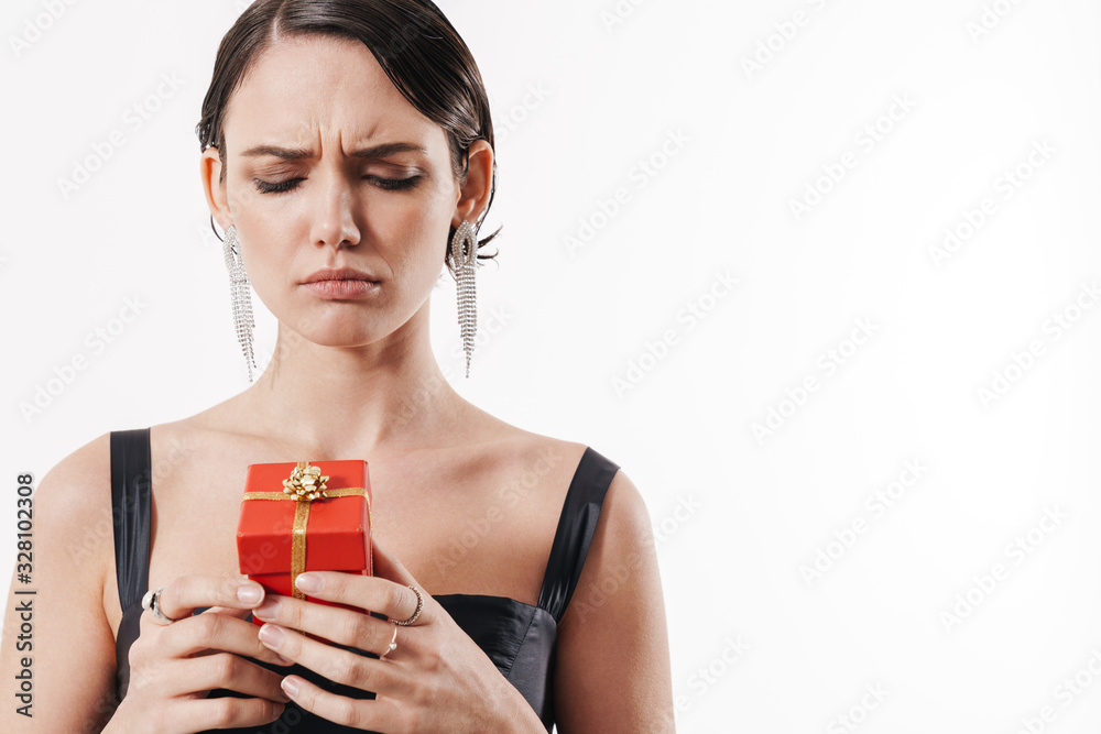 Sticker Attractive young brunette woman wearing black cocktail dress