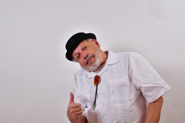 Smiling old man enjoing the view.Elderly gentleman admiring a work of art.Senior man adoring what he sees.