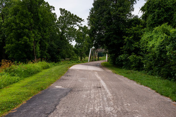 A stretch of the original route 66 wih an old steel bridge in the State of Missouri, USA.