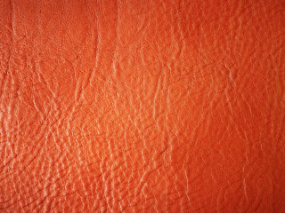 Orange background. Genuine Leather. Leather texture. Vegetable tanned leather. Design. Production of leather good