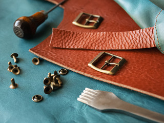Production of genuine leather. Instruments. Genuine leather design. Metal fittings. Clothing industry.