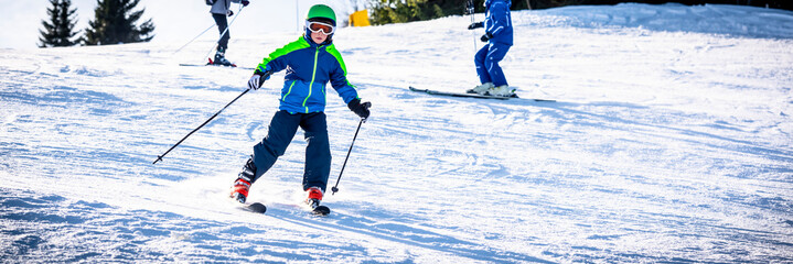 Children have fun on the high altitude ski slope - Alps
