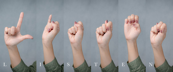 Crop shot: Hand of a woman gesturing english alphabet letters for word "Listen" Silent words, Hearing, Listen up, World deaf day - 30th September, Caring and sharing, Disable, Understanding.