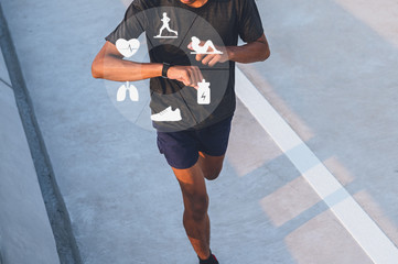 Running man with smart watch. Concept of The technology to check health while exercising.